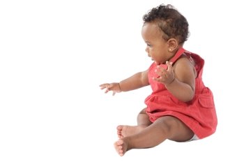 adorable baby crawling wearing a red dress