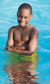 boy in the swimming pool in summer