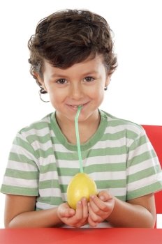 Adorable boy drinking juice of lemon on a over white background