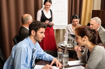 Business people have company meeting at restaurant waitress ordering