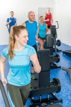 Fitness treadmill smiling woman enjoy group class at gym