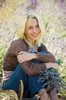 Woman Sitting In Lavender Field