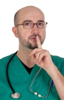 Doctor with finger to lips for silence isolated on white background