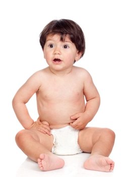 Baby girl with diaper sitting on a over white background