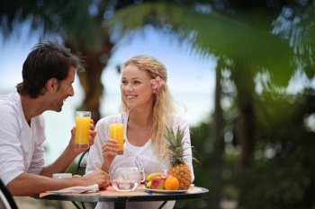 Couple having breakfast in luxury resort