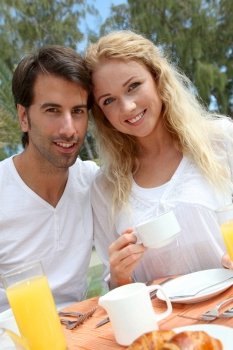 Couple having breakfast in luxury resort