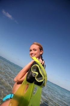 Woman getting out of water after snorkeling journey