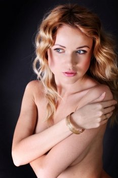 Portrait of beautiful blond woman wearing jewelry