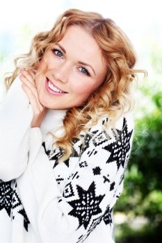 Portrait of beautiful blond woman with wool sweater