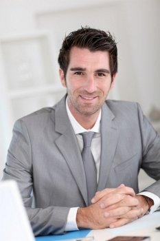 Portrait of smiling businessman at work