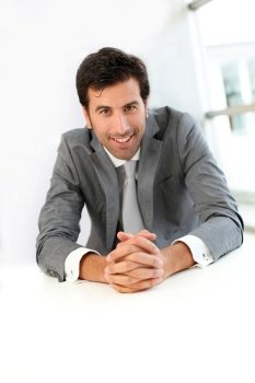 Smiling businessman looking at client
