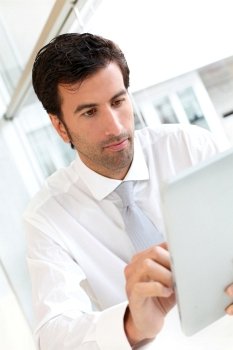 Businessman working on electronic tablet