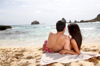 Back view of couple looking at the sea