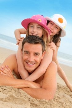 Father with children at the beach