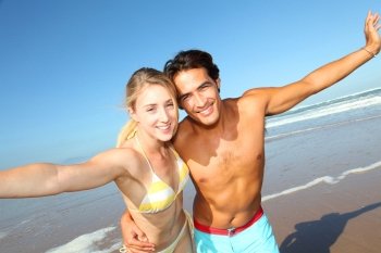 Young couple having fun at the beach