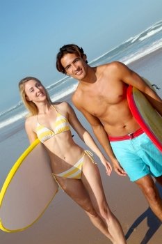 Couple at the beach with surfboard