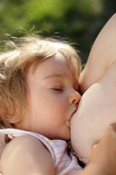 Breastfeeding - back light, shallow depth of field