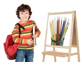 child studying whit slate whit drawing of pencils