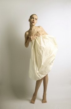 elegante girl with sheet of paper. studio photo.