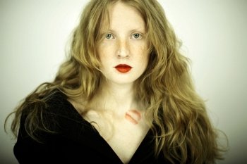 Fashion photo of charming red girl with freckles