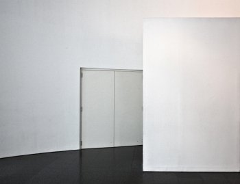 white blank wall with door photo