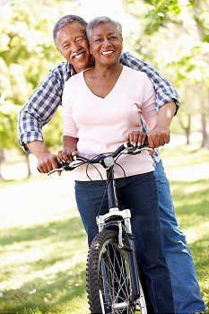 Senior  couple cycling in park
