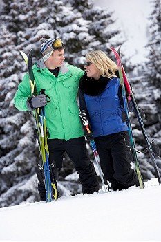 Young Couple On Ski Holiday In Mountains