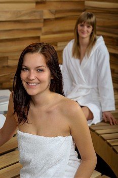 Woman smiling and looking fresh after relaxing treatment spa center