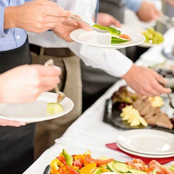 Business catering people take buffet food during company event