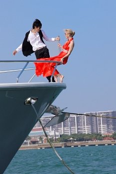 Man and woman on bow of boat