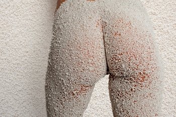 Nude bottom covered in polystyrene balls