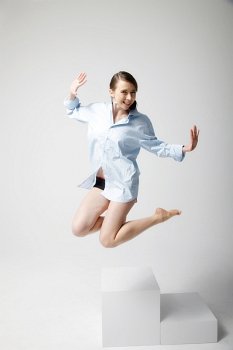 Jumping woman wearing shirt