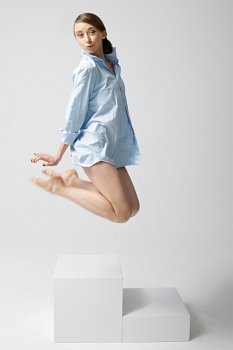 Woman jumping in shirt