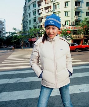 Young girl in coat on street