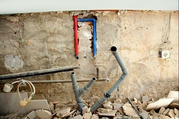 electrical and plumbing installation in kitchen interior construction