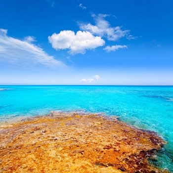 Formentera Es Calo beach with turquoise sea in Mediterranean balearic islands