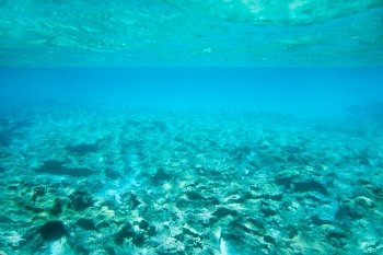 Ibiza Formentera underwater rocks in turquoise sea horizon