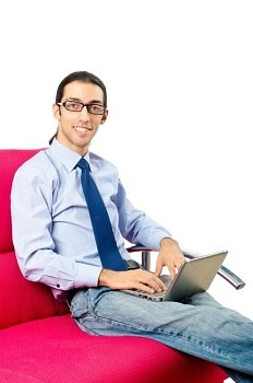 Student working with laptop sitting on sofa