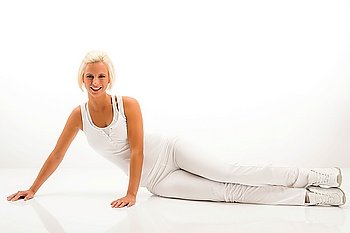 Woman stretching her body fitness exercise sitting on white floor