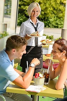 Couple waiting waitress bringing fresh sandwich restaurant sunny terrace