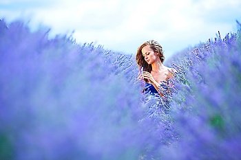 Woman standing on a lavender field