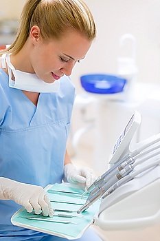 Dental nurse prepare professional medical tools at stomatology laboratory
