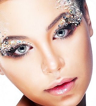 Cosmetics and make-up, beauty and fashion. Close-up portrait of beautiful woman with bright glamour make-up, clean skin