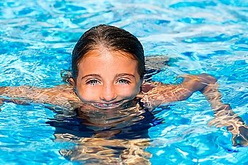 beautiful blue eyes kid girl at the pool with face in water surface