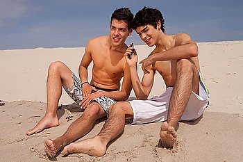 Two young friends relaxing at the beach