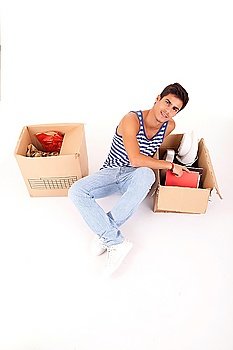 Young man moving to new house, isolated over white