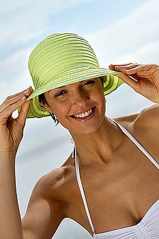 Woman wearing bikini and hat