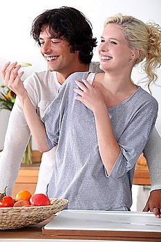 couple laughing in the kitchen