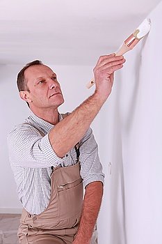 Painter painting wall