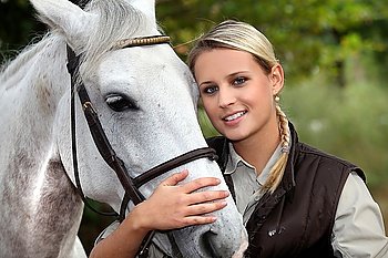 Blond woman with her horse